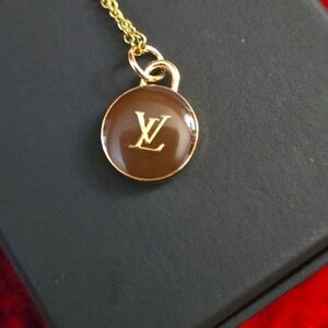 LV DOUBLE SIDED CHARM